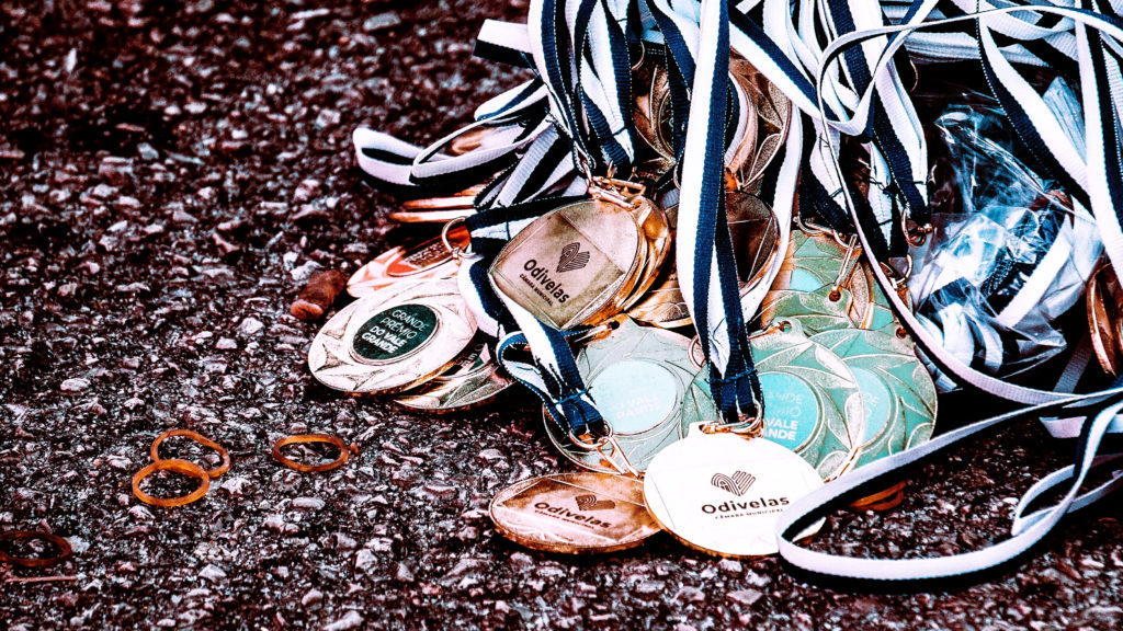 A group of assorted medals are shown on the ground